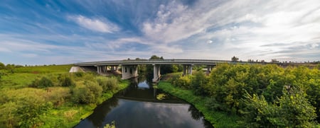 panorama-view-near-big-huge-bridge-across-river-2023-11-27-04-59-55-utc-scaled