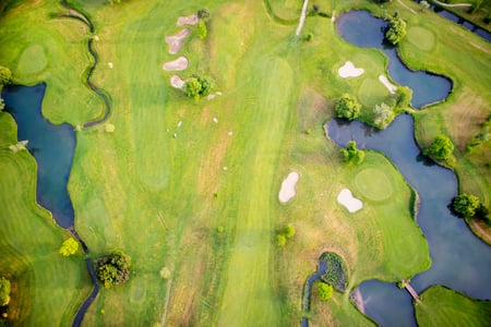 top-view-of-a-golf-course-2021-08-26-15-37-01-utc-scaled